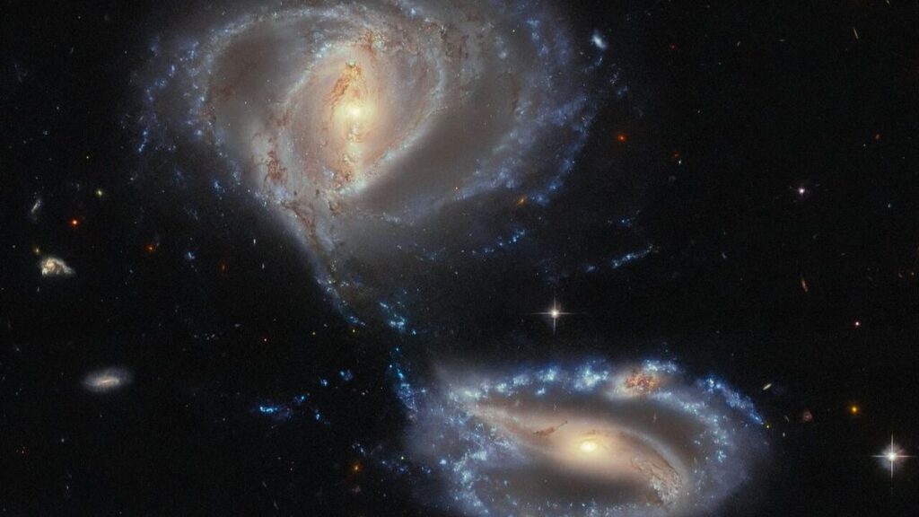 Two galaxies that appear to be in the process of merging. They